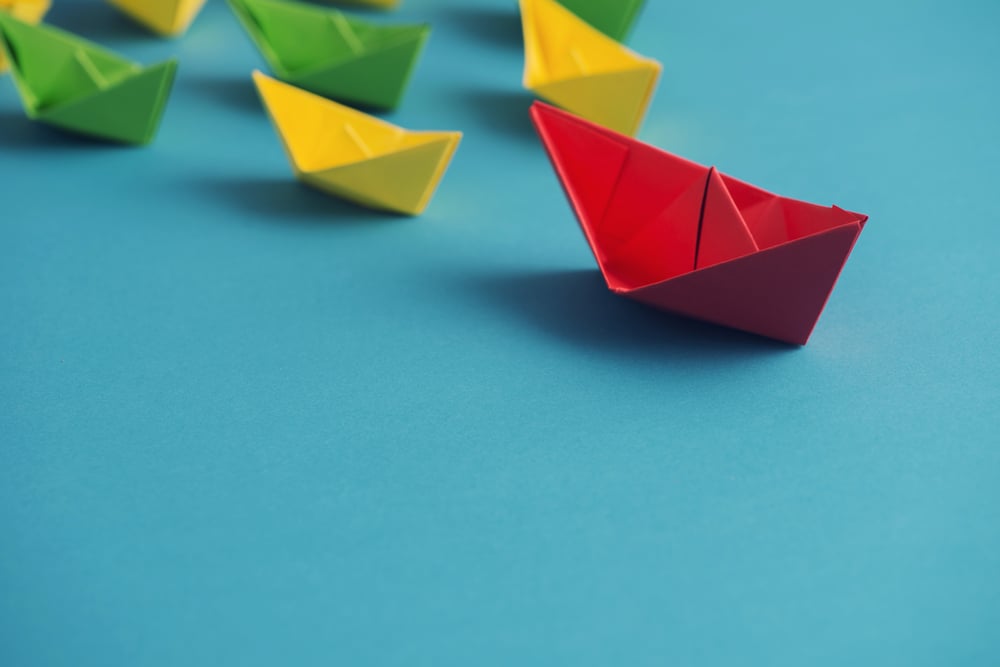 photo of paper boats representing leadership