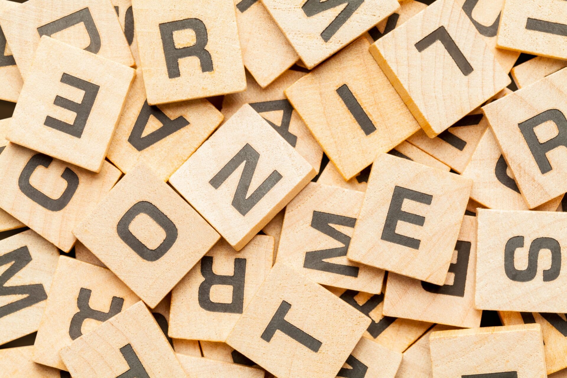 Photo of a pile of wooden letter game tiles