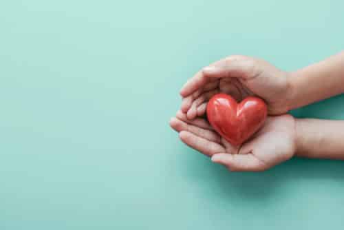 Photo of someone holding a love heart