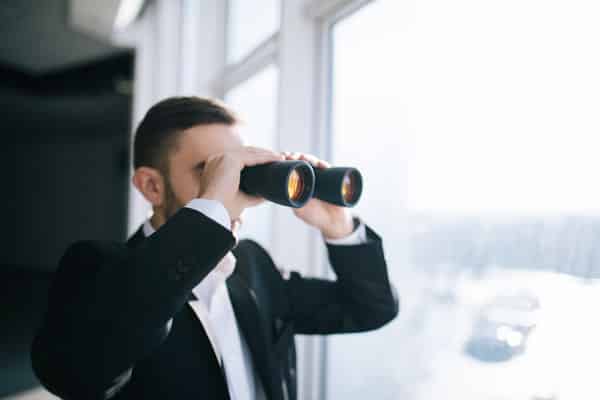 Person looking through binoculars