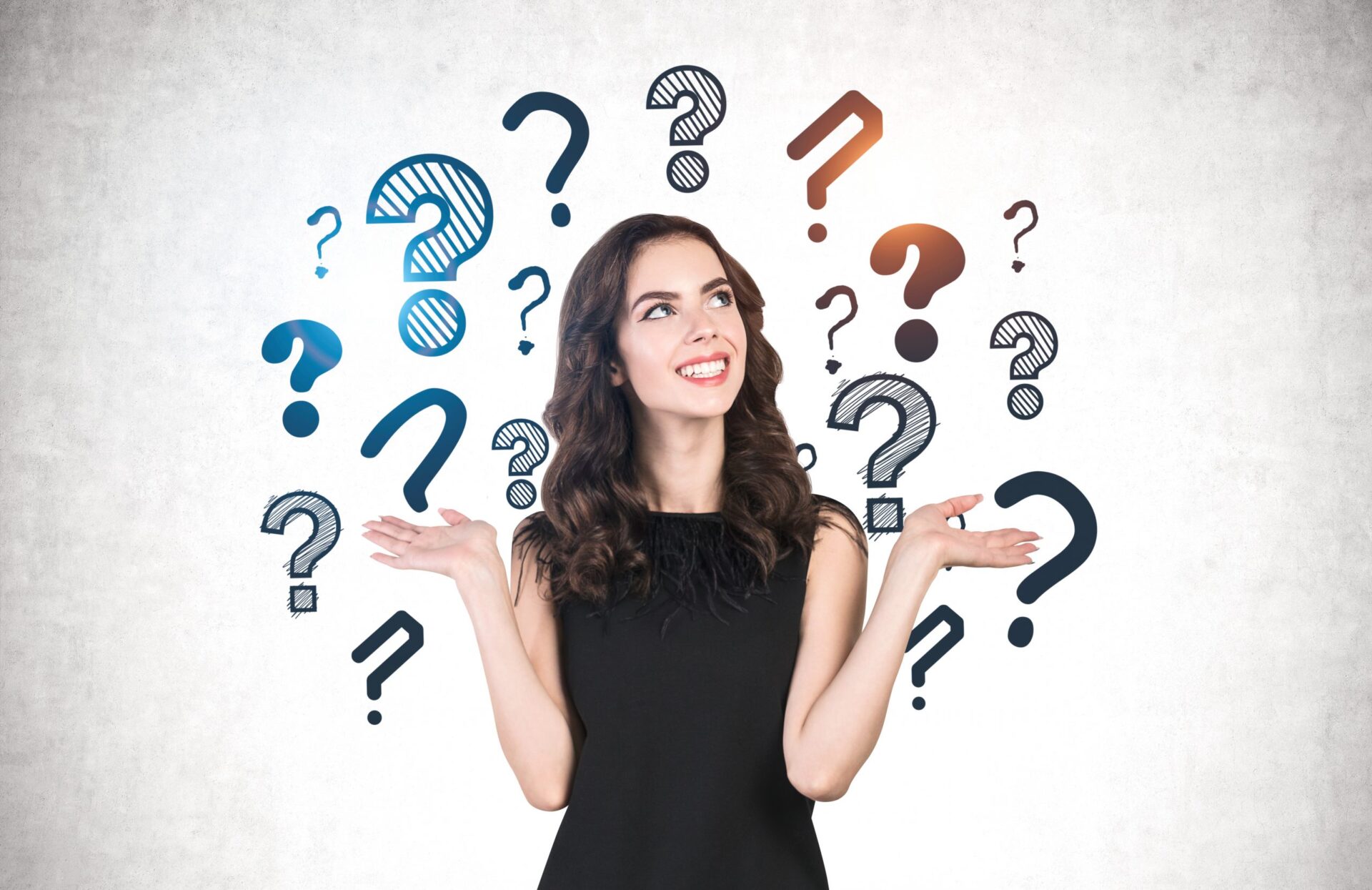Photo of someone looking confused surrounded by question marks