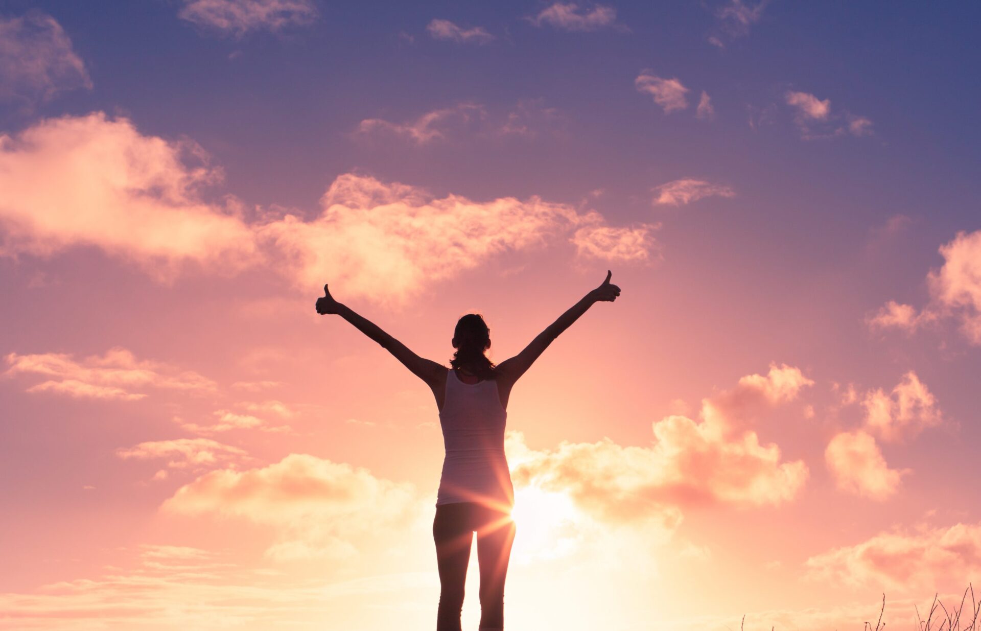 Photo of a women with her thumbs up