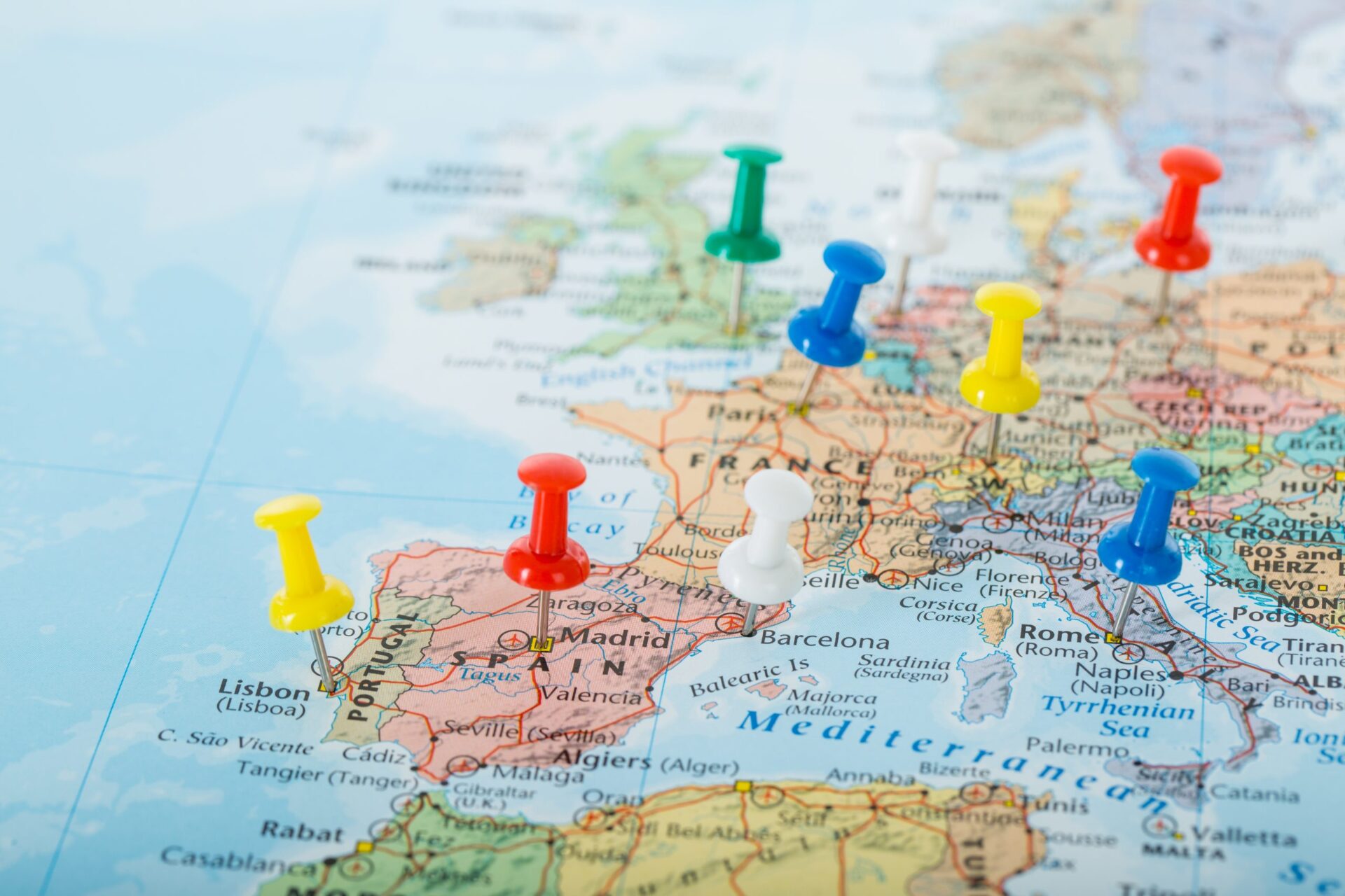 Photo of pins stuck on different places on a map