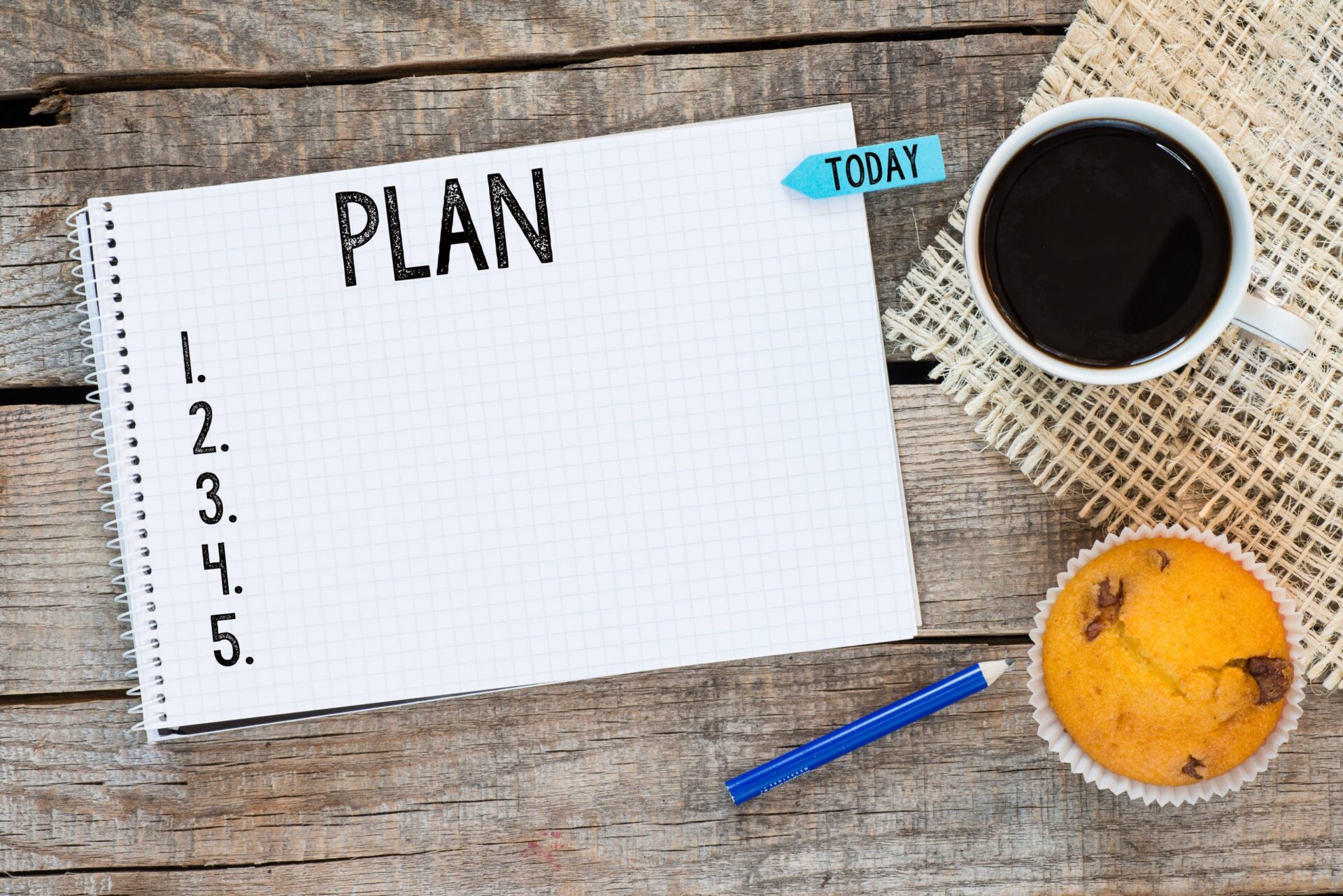 Photo with the word 'plan' written on a notepad
