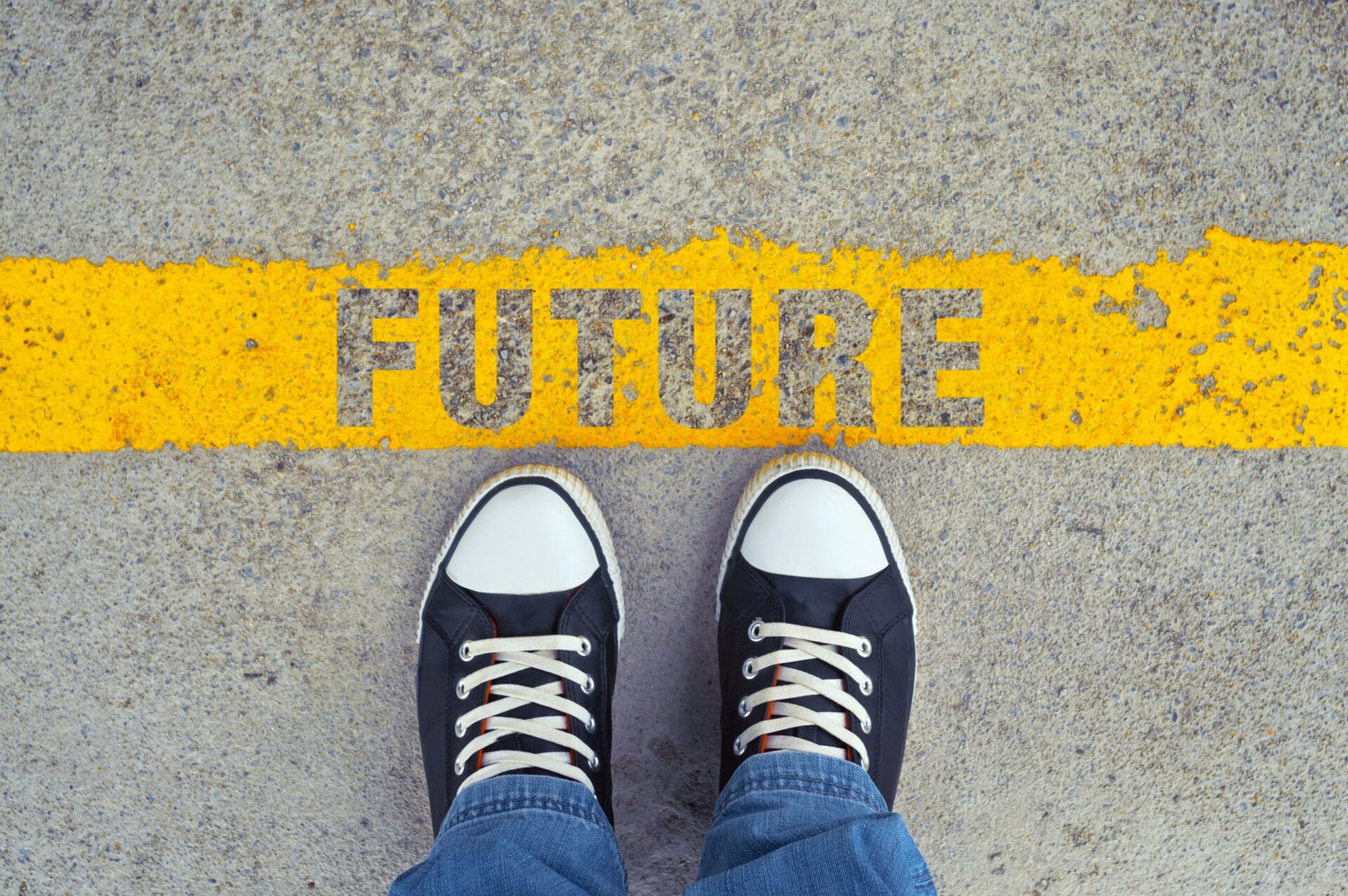 Photo of someone stood by a yellow line that says 'future'