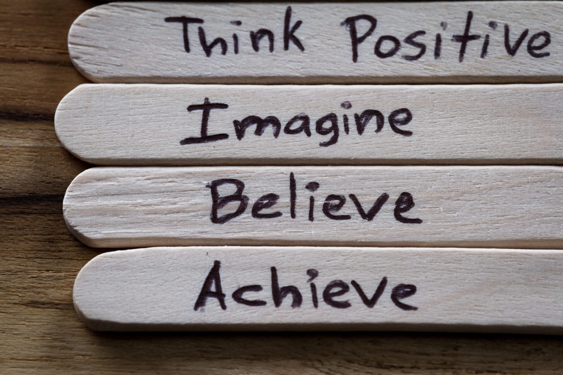 Photo of lolly sticks saying motivational words