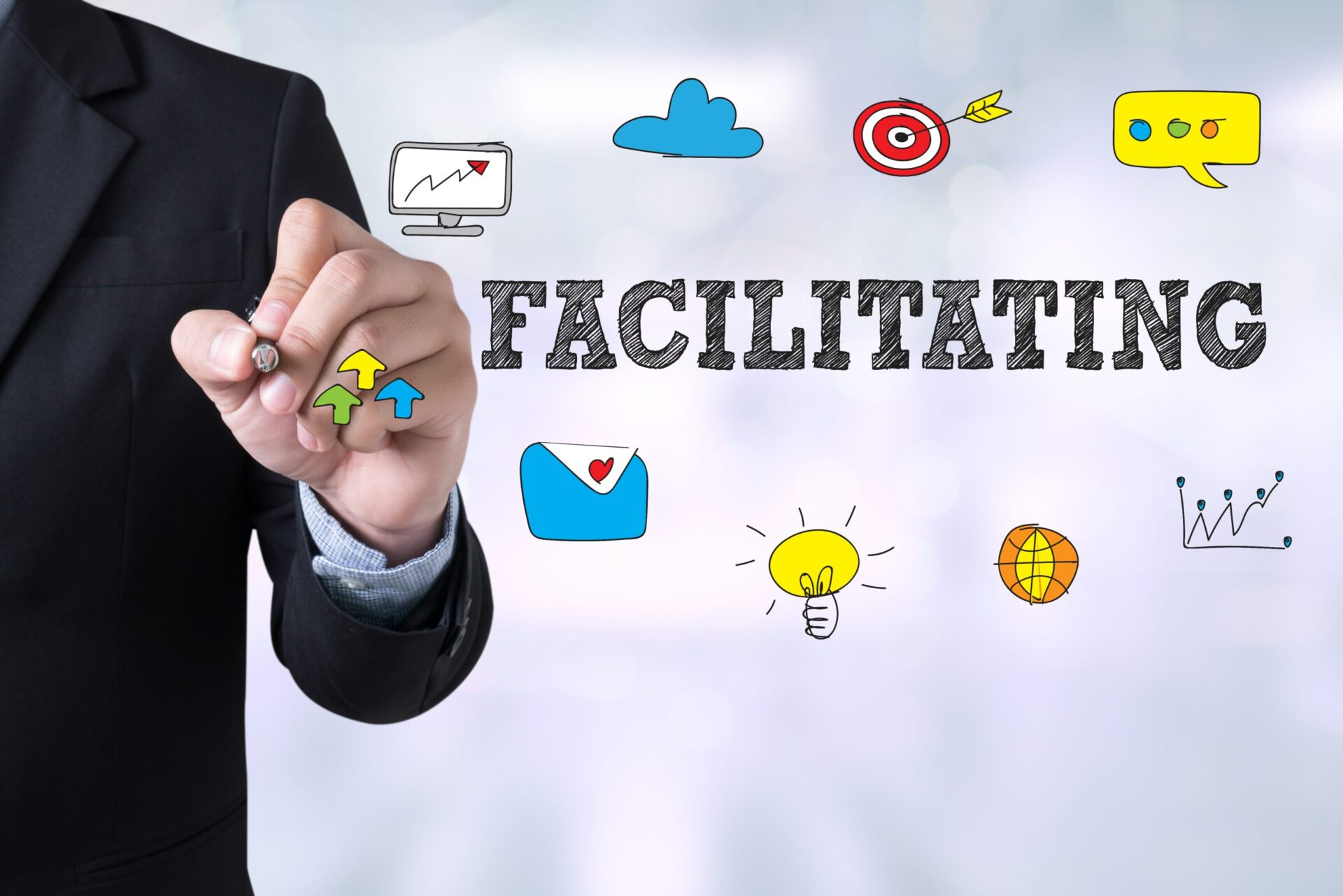 Photo of the word 'facilitating' with drawings around it